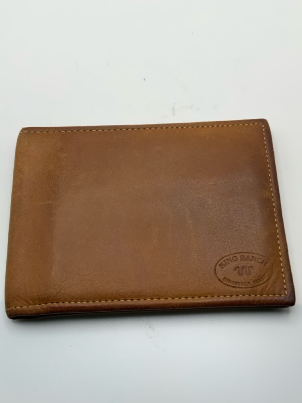 King Ranch Men's Saddle Brown Leather Bi-Fold Wallet with “Running W” logo